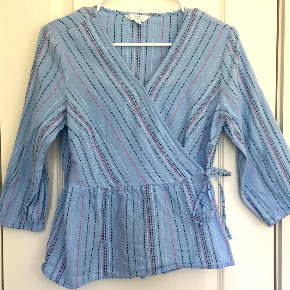 Light blue shirt ties at the waist